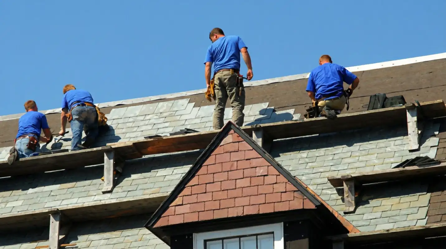 Roof replacement in progress with a team of professional contractors installing new shingles on a residential home in Mesa, AZ
